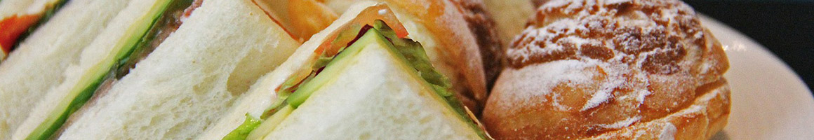 Eating Sandwich at Lan Huong Quan Food To Go restaurant in Santa Ana, CA.